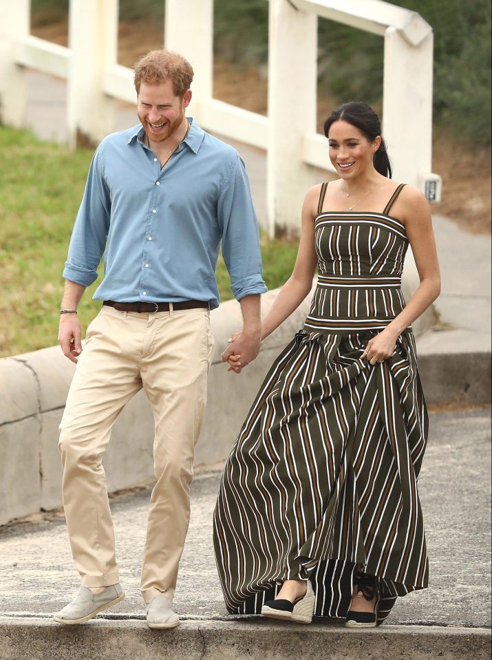  At Bondi Beach today, Meghan teamed a Martin Grant maxi dress with a pair of £80 black wedge espadrilles by Castaner