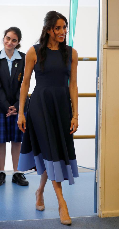  Meghan later changed into an elegant blue dress