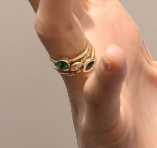  Fans pointed out that her stackable rings could represent the birthstones of her (green peridot), Prince Harry (blue sapphire) and her baby (diamond)