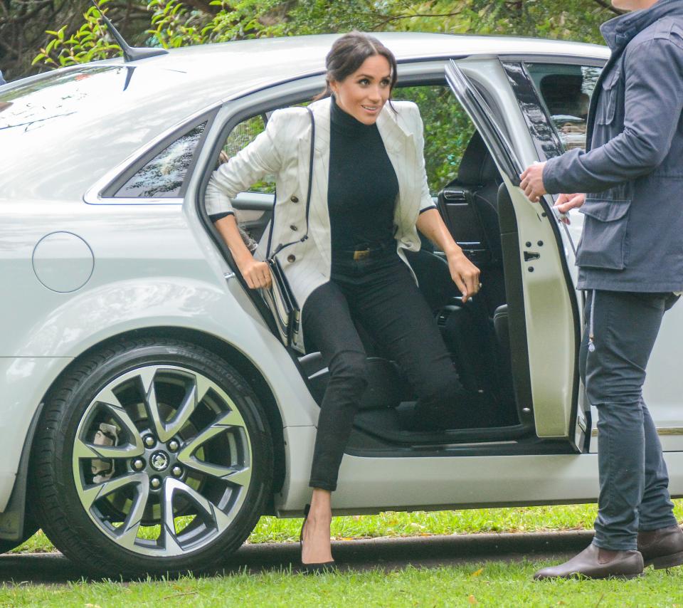  Meghan arrives in a car after taking a morning off from their exhausting tour