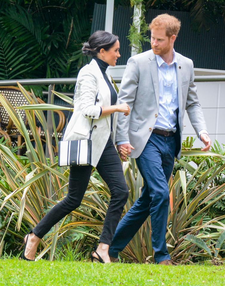  The pair hold hands as they make their way to a reception with the Australian PM