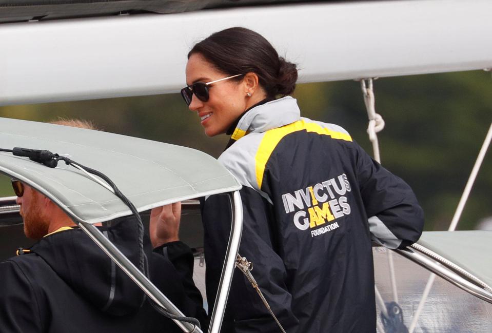  The Duchess of Sussex watches the sailing event of the Invictus Games from a friend's boat at Farm Cove