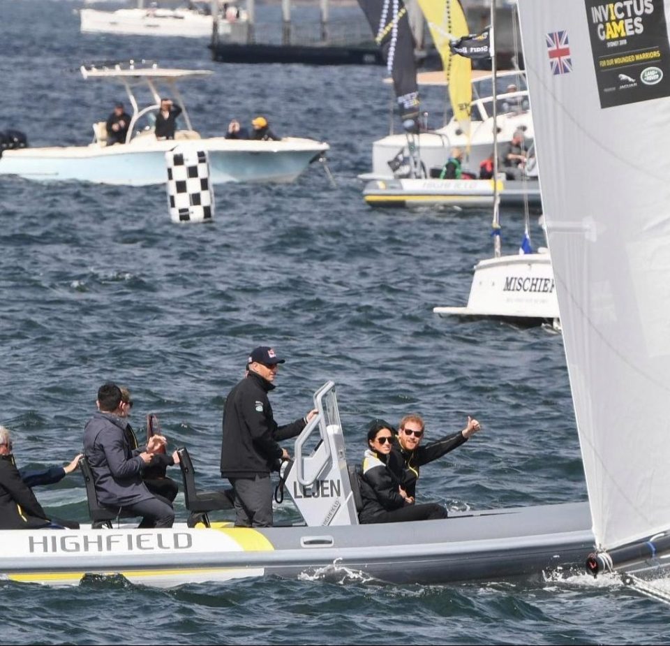  Prince Harry gives an enthusiastic thumbs up as he and Meghan Markle enjoy a sail