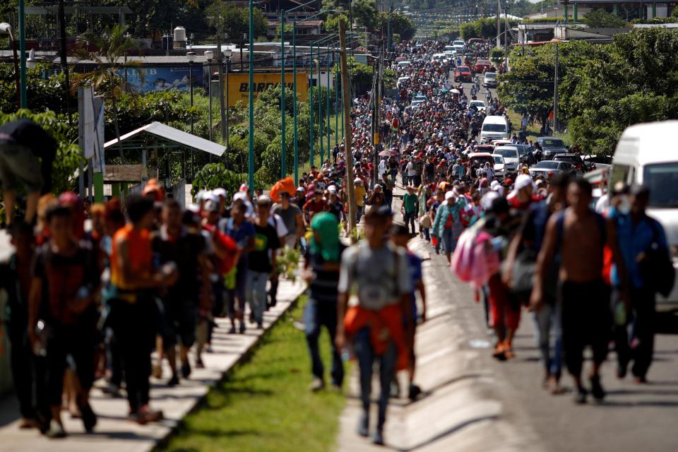  Central American migrants walk along the highway near the border with Guatemala