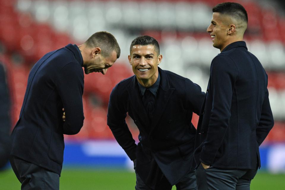  Juventus star Ronaldo, 33, middle, shares a joke on the hallowed Old Trafford turf