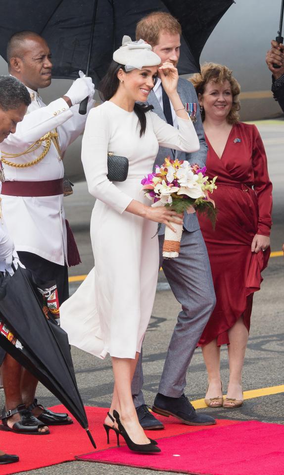  She sported a clutch costing £173 as she arrived in a windy Fiji