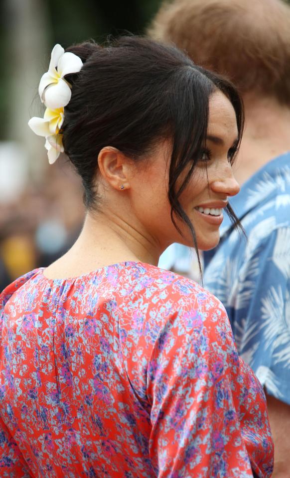  Meghan wore flowers in her hair for the visit to the uni after joining Harry later in the day