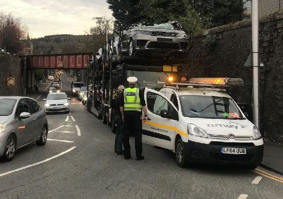  The car transporter dragged the vehicles under a low railway bridge in Perth