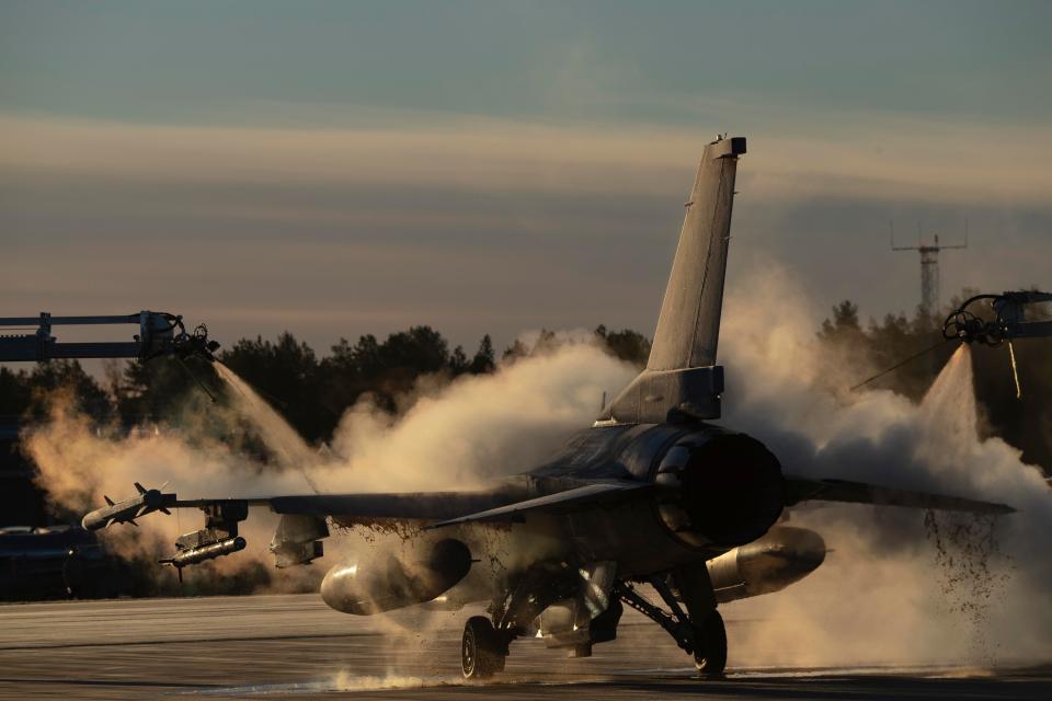  S Air Force F-16 Fighting Falcon being de-iced in preparation of the NATO military exercise Trident Juncture