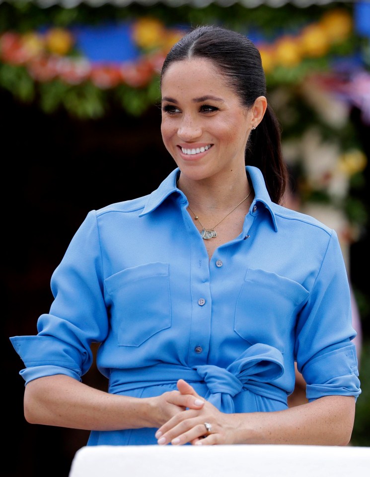 Meghan was all smiles as she dazzled in her second dress of the day