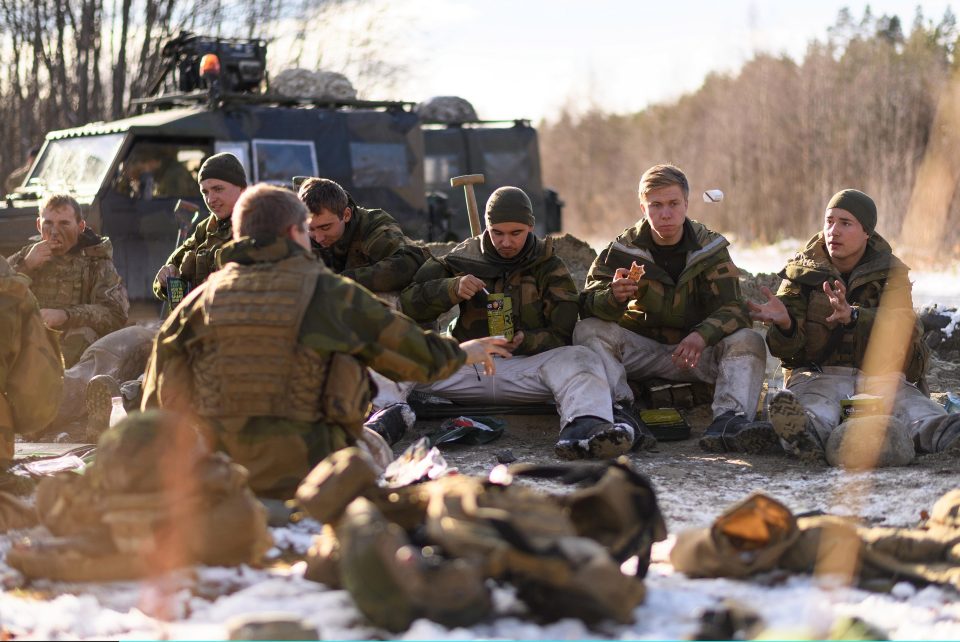  Norwegian engineers mix with members of the Royal Engineers as they eat their lunch during pre-exercise integration training