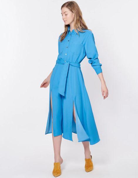 The shirt dress features much higher slits