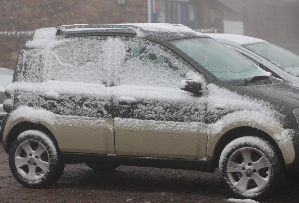  A snow covered car in the car park at Cairngorm Seasonal weather