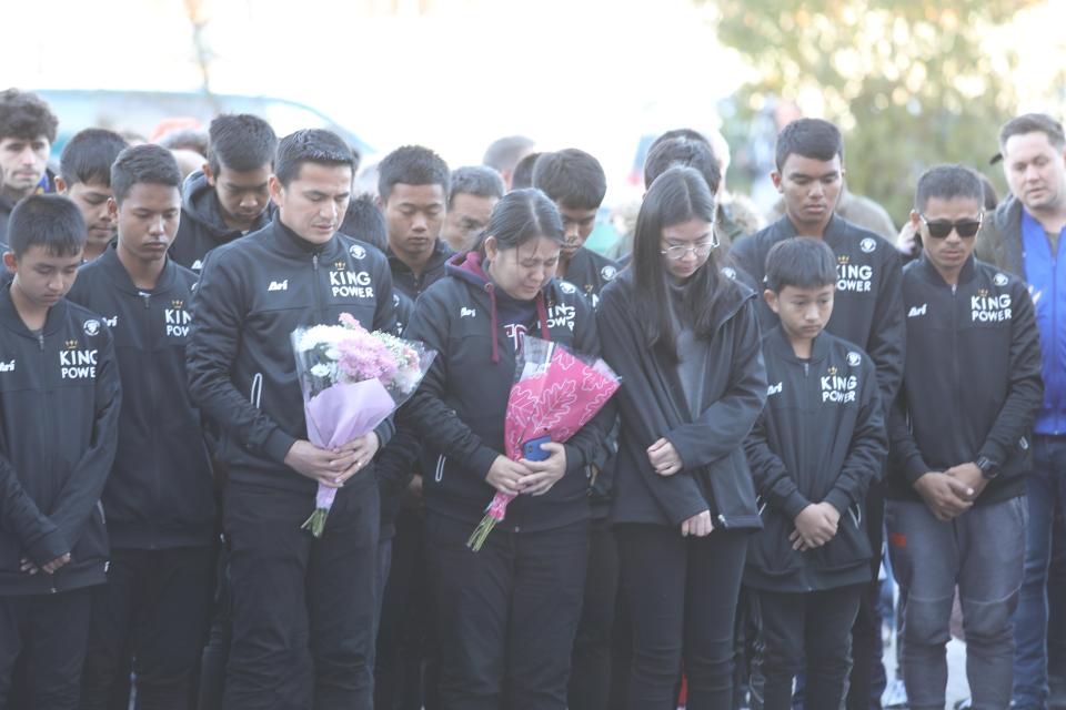  An emotional group of Thai schoolchildren and adults attended the site of the tributes earlier this afternoon