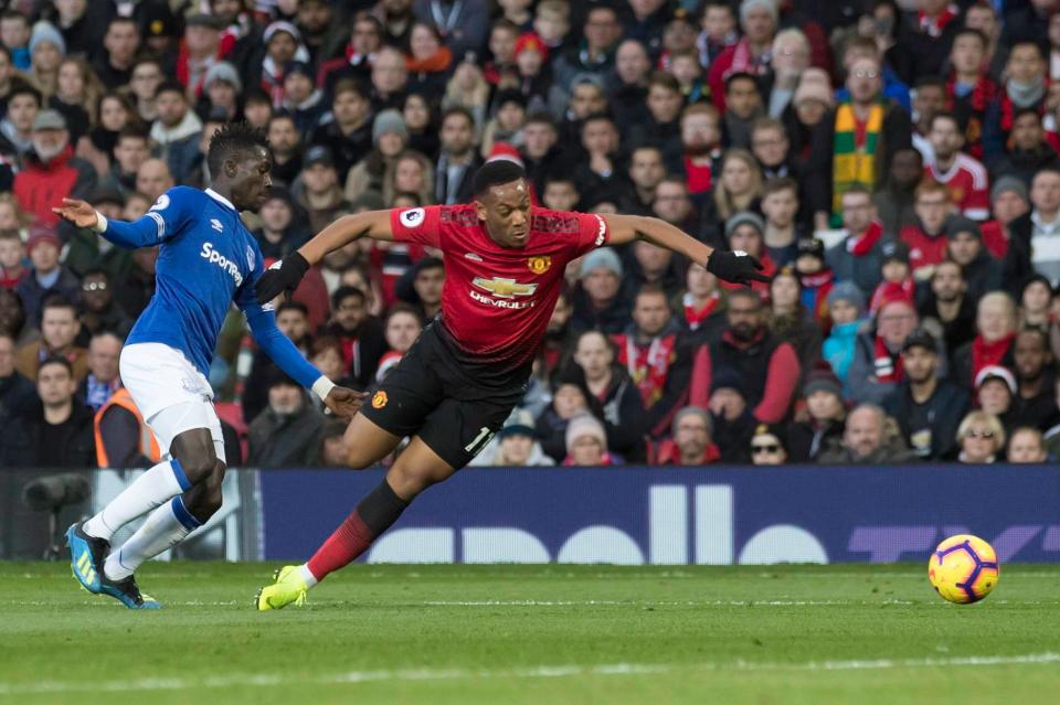  Anthony Martial went down under the challenge of Everton midfielder Idrisssa Gueye - but has been called a 'diver' by Everton boss Marco Silva