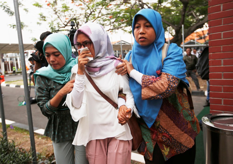 Relatives of passengers on board arrive at crisis centre at Soekarno Hatta International airport near Jakarta