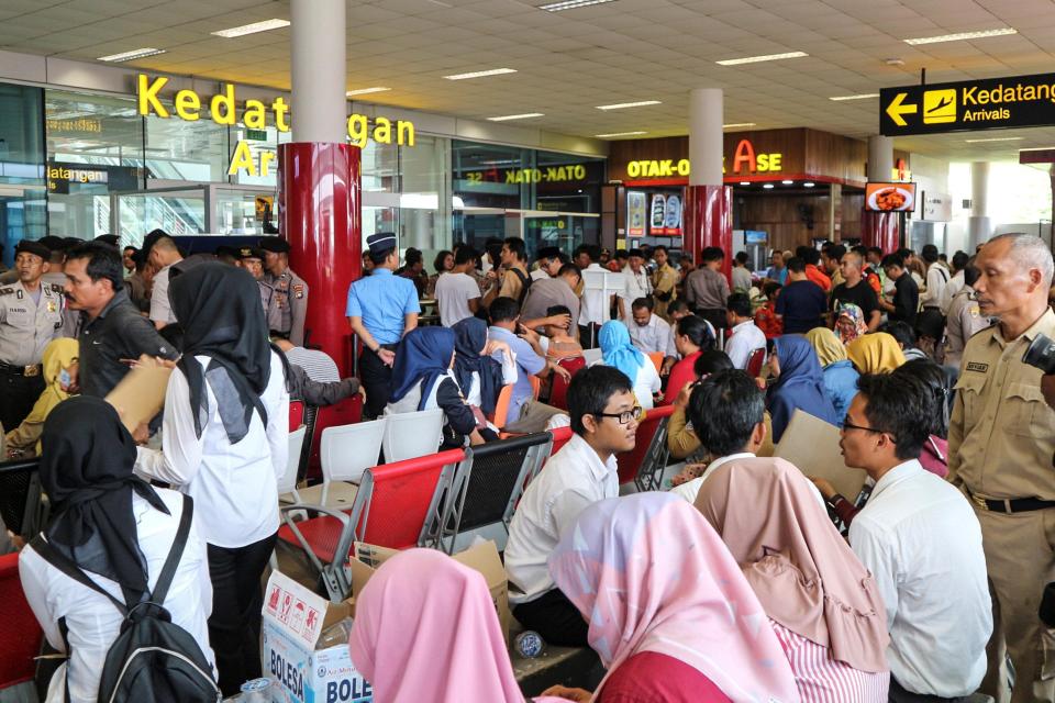  Relatives of passengers of the Lion Air plane that crashed into the sea are seen at Depati Amir airport in Pangkal Pinang