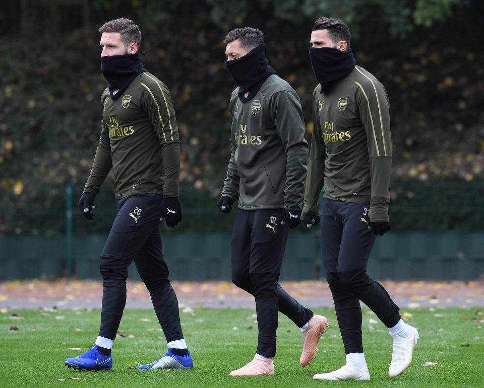 Arsenal battled the chilly conditions at training this afternoon