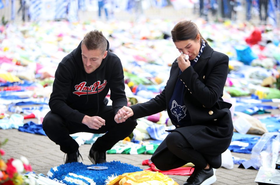 Leicester City's Jamie Vardy and wife Rebekah Vardy are seen yesterday laying a wreath in memory of those killed in the helicopter crash outside King Power Stadium