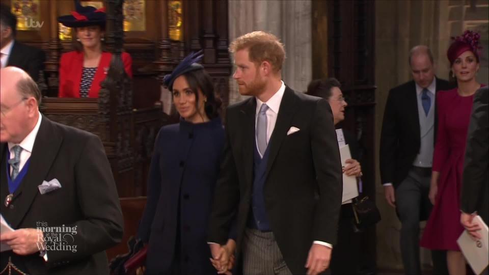 The loved-up couple are holding hands