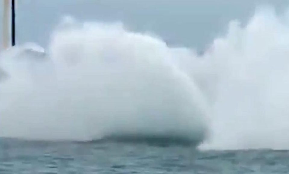  The tourist boat is then engulfed in a massive splash as the whale crashes back into the water