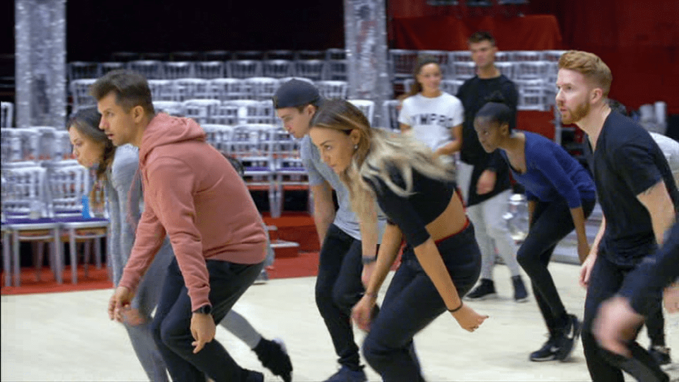  Katya, far left, and her husband Neil, far right, appear to have been kept apart in the group routines since Katya snogged her celebrity partner Seann Walsh