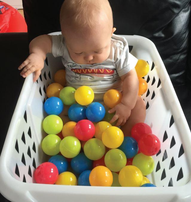  With prices for trendy baby classes rising, a washing basket can create the perfect ball-pit