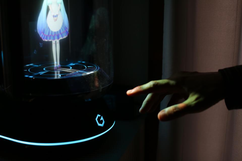  Kondo can communicate with his Hatsune Miku hologram by pushing the 'Home' button on its control panel