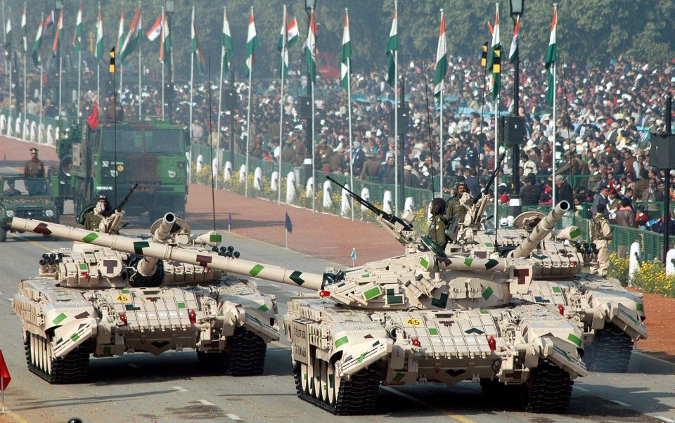 Russian tanks on display last year. The Red Army is reportedly building up a military force on the border