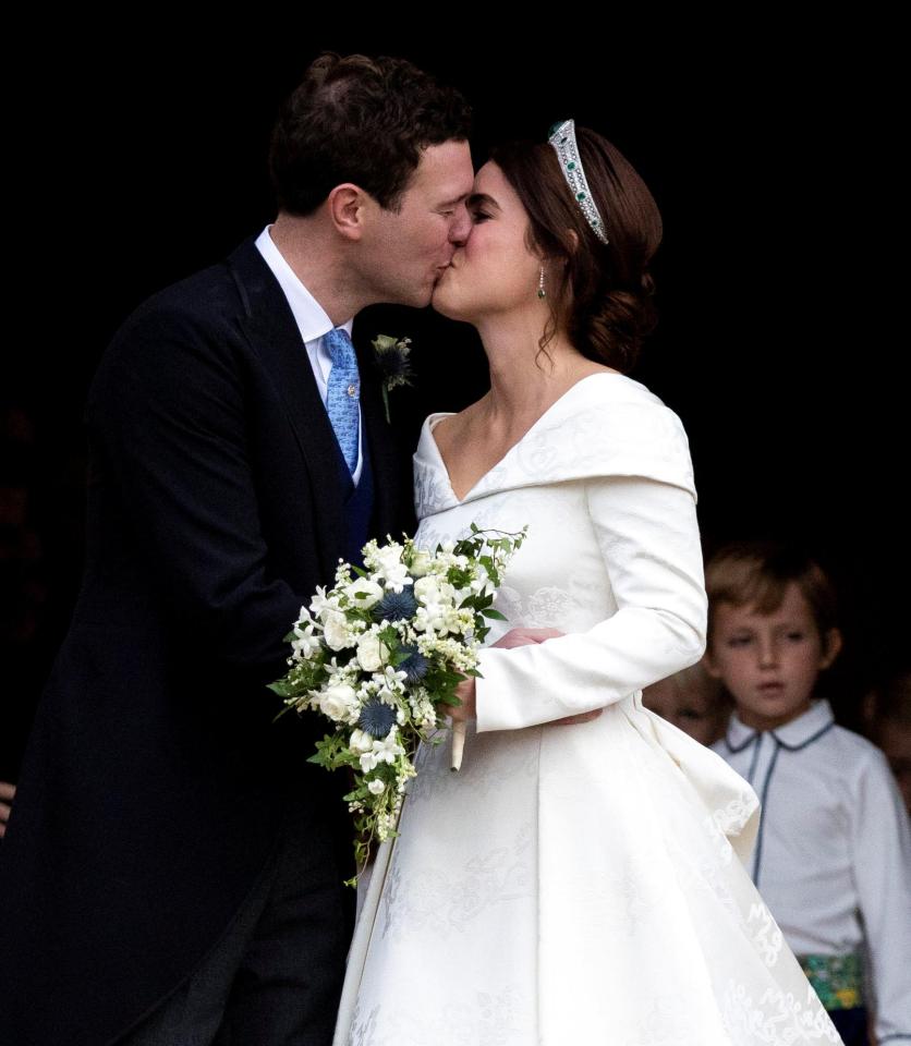  Eugenie kisses her new husband on the steps of Windsor Castle after their wedding