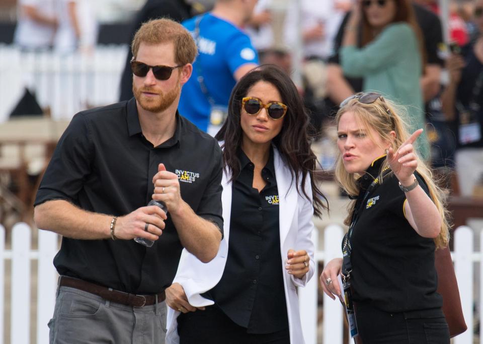 Meghan and Harry pictured with Amy Pickerill, Meghan's Deputy Private Secretary