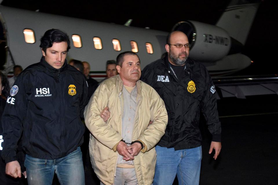  El Chapo, centre, is escorted from a plane at Long Island MacArthur Airport, in New York last year to be face justice at today’s trial