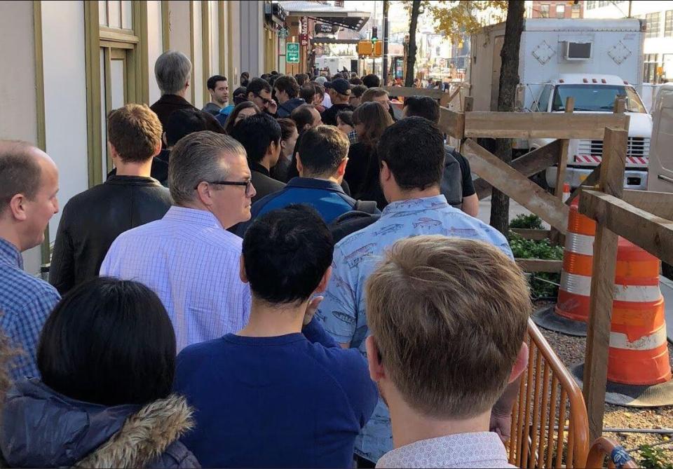  Workers filled the sidewalk around the company's office in New York this afternoon