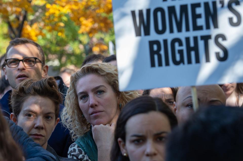  A woman holds a sign during the rally in New York today