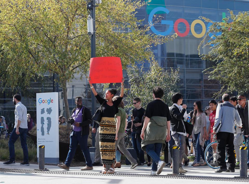  A Google Inc., employee holds up sign in California