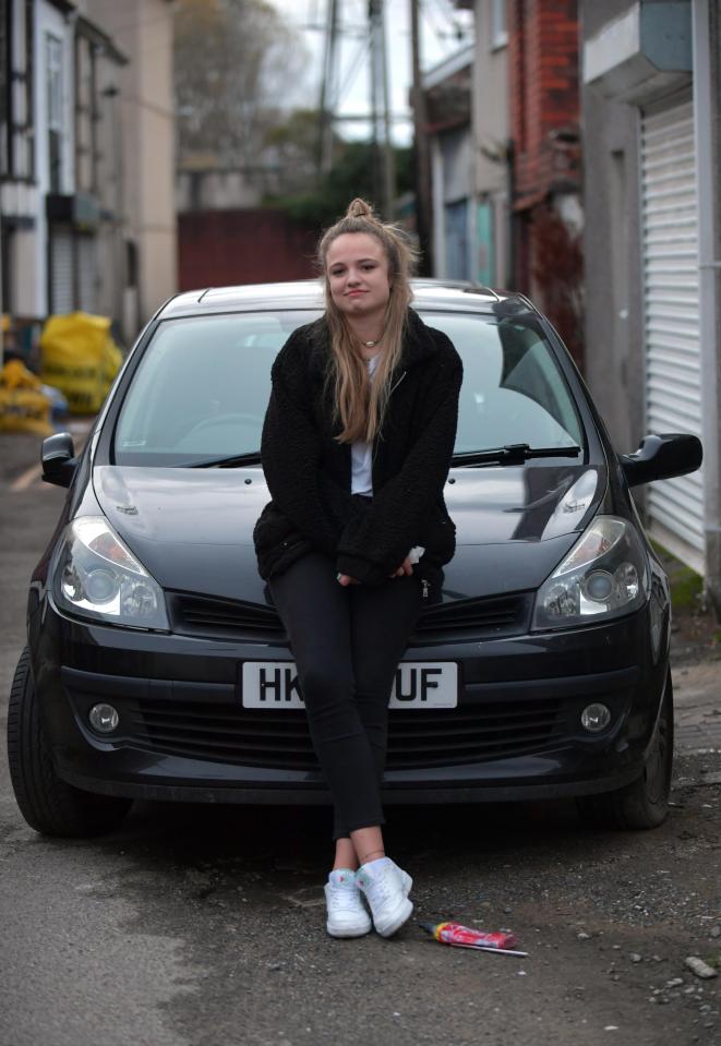  Rachel Holmes with her Renault Clio - which has been disturbingly defecated on TWICE in ten days