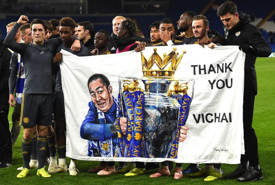  Leicester players hold out a banner in owner of their tragic late owner