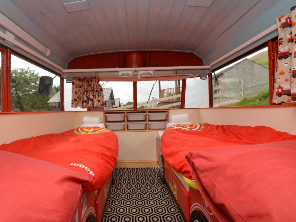  The second bedroom includes two beds with fire engine bed steads