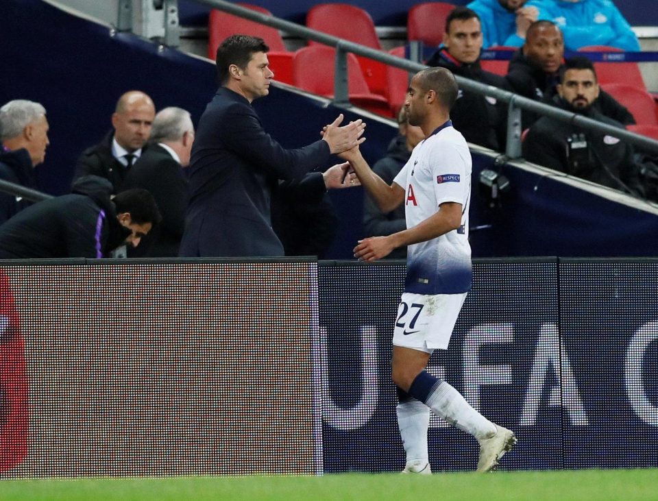  Oncoming Erik Lamela shakes hands with Lucas Moura after the substitution that irked Spurs fans