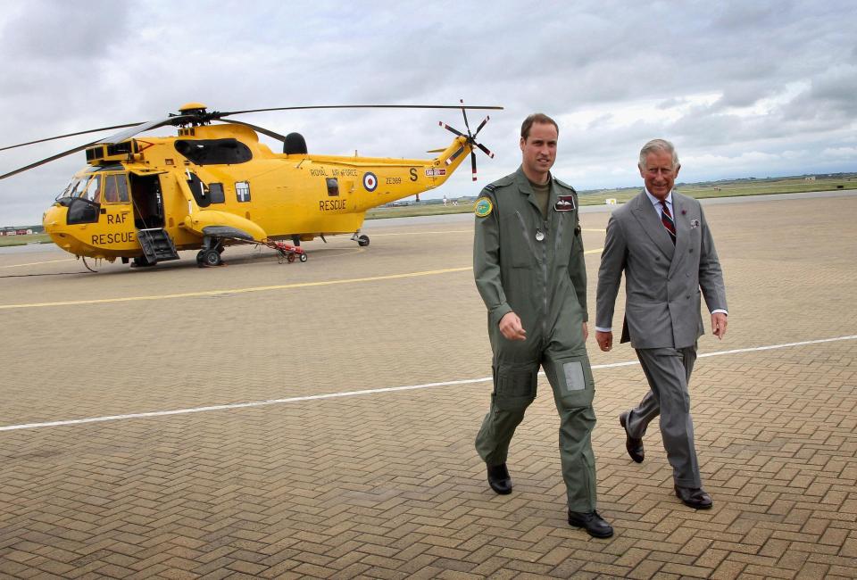  2012: The Duke of Cambridge showing the Prince of Wales one of the Sea King helicopters he captains as he visits RAF Valley on Anglesey, during his annual summer tour of Wales