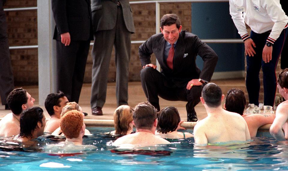  1991: The Prince of Wales joking with a group of unemployed youths during a visit to Warner Holiday Centre, Caister-On_Sea, Norfolk