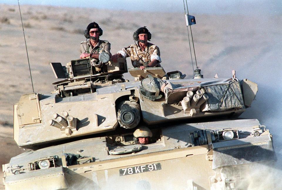  1990: Riding in a Challenger tank of the Royal Scots Dragoon Guards (7th Armoured Brigade) while on a visit to British troops in Dharhan in Eastern Saudi Arabia