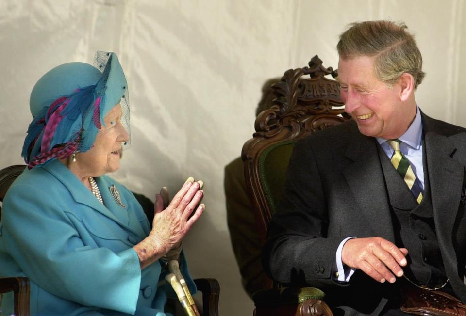  2001: The Queen Mother sharing a joke with her grandson, known as the Duke of Rothesay in Scotland, during the unveiling of an Aberdeen Angus sculpture at the Alford Transport Museum