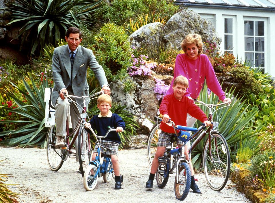  1989: The Prince and Princess of Wales with sons Prince William, right, and Prince Harry preparing for a cycling trip in Tresco during their holiday on the Scilly Isles