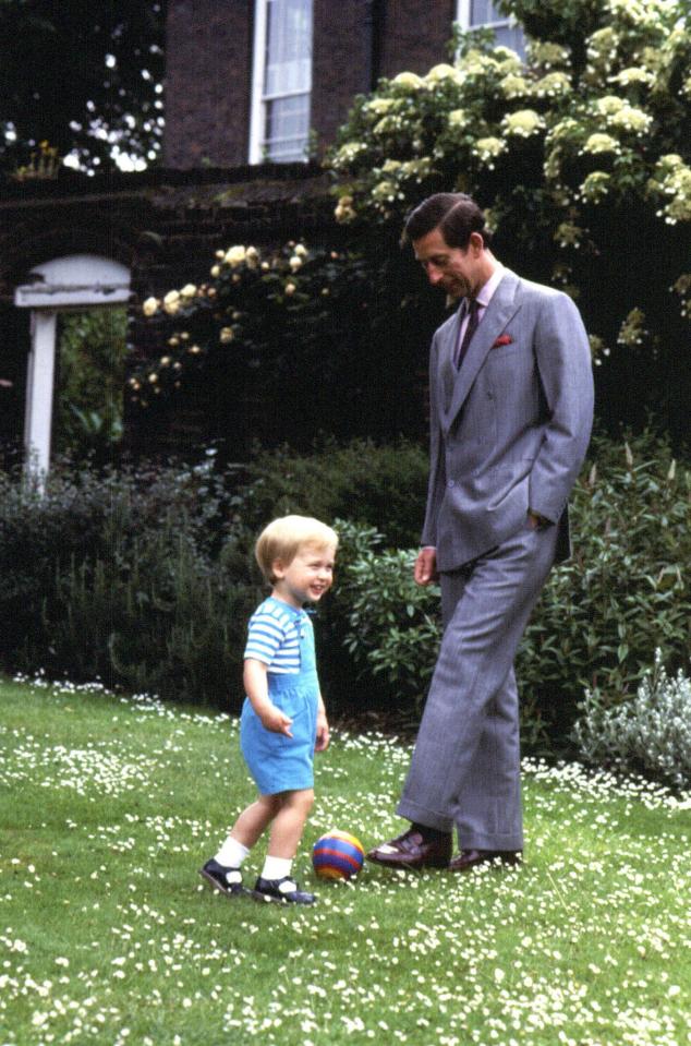  1984: Prince William plays football with his dad in the garden of Kensington Palace