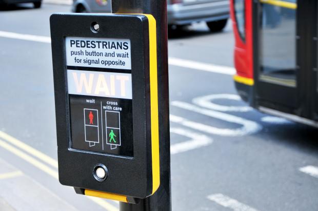 You have to push a button and wait for the green man at a pelican crossing