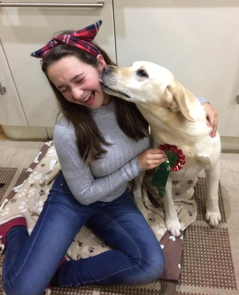  Rita and Philip Potters' granddaughter Lauren with their Labrador Daisy who was stolen