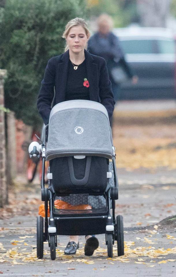  She was pictured pushing their baby daughter Isla in her pram