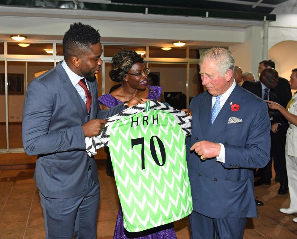  Former footballer Joseph Yobo presents Prince Charles with a Nigerian National football shirt as a birthday present