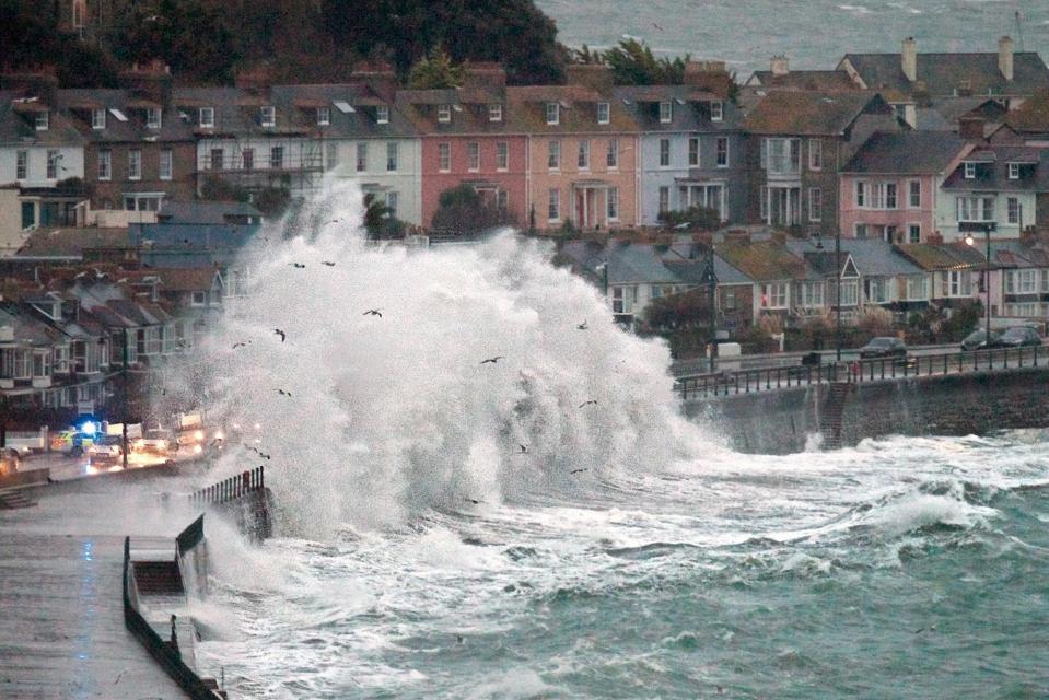  Strong wind from the South brings warmer air and heavy rain showers, whipping up the waves in Penzance, Cornwall